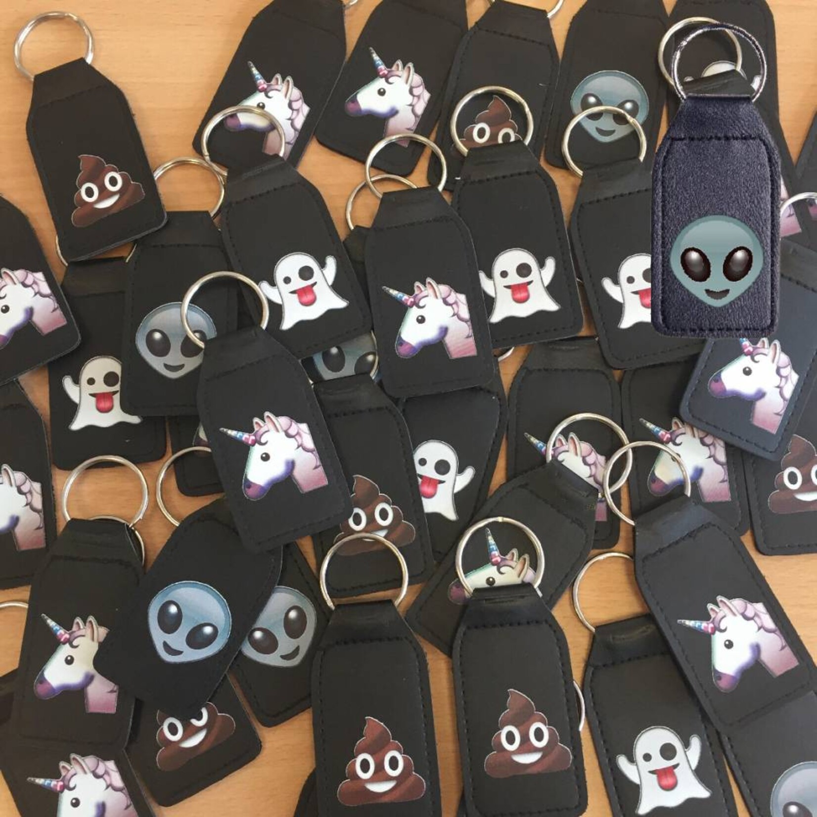 Lachende drol emoji sleutelhanger
