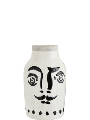 Terracotta Vase With Face. Cheerful face with mustache in black painted glaze on white ceramic, give it a good haircut wi...