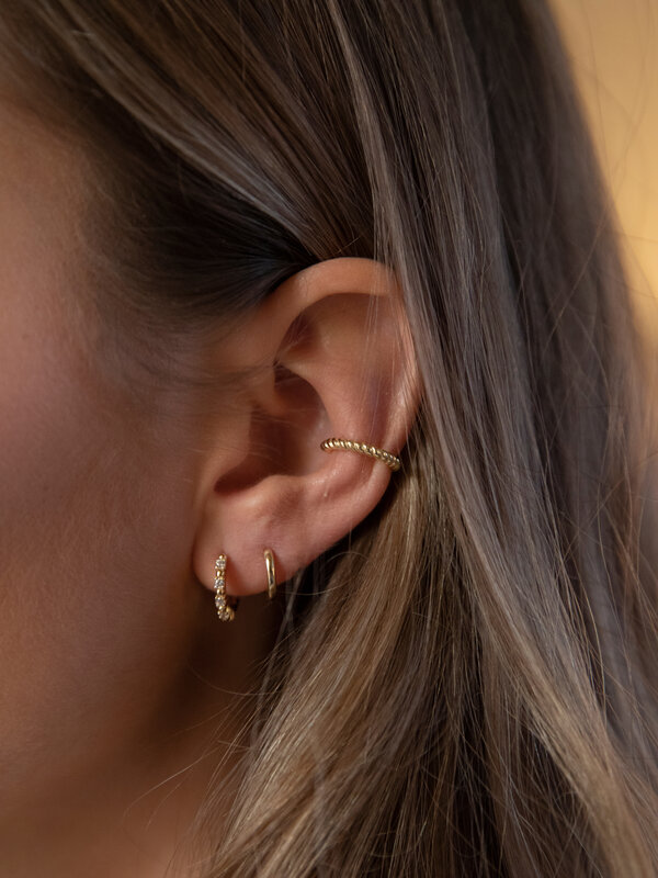 Les Soeurs Ear Cuff June Twisted 3. Complete your look in the most elegant way with our gold ear cuff with an edgy and co...