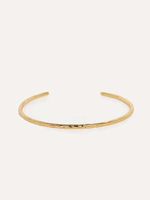 Bracelet Mirella. This classic bangle bracelet integrates seamlessly into any look. Gold-dipped and one-size-fits-all, th...