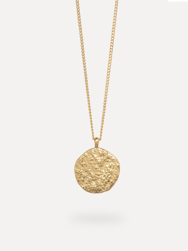 Les Soeurs Necklace Rana Amulet 1. Inspired by natural shapes, this organic coin necklace has a robust texture. Wear this...