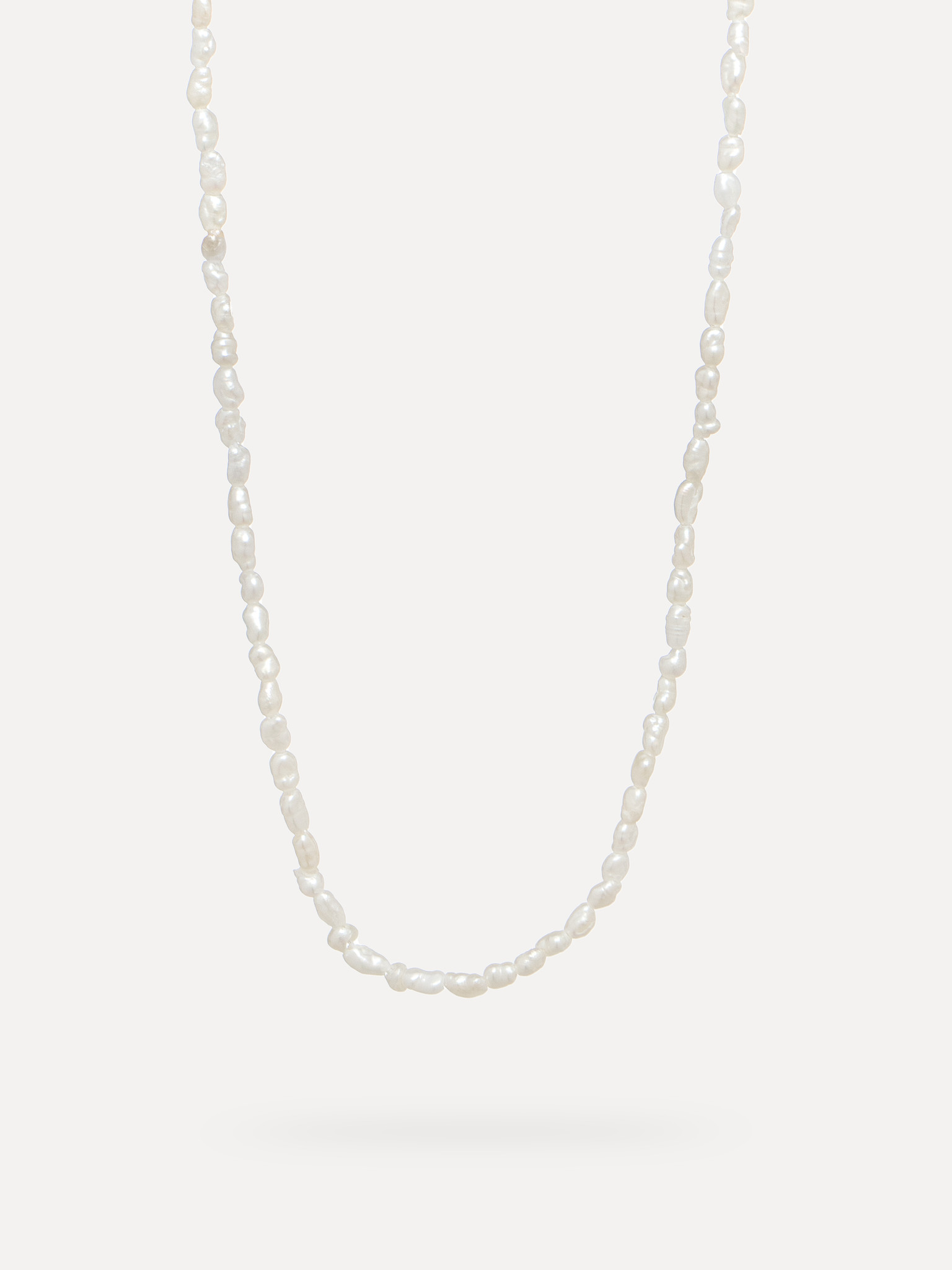 Les Soeurs Necklace Rayan 1. An elegant strand of fine imitation pearls makes up this classic necklace. A dreamy look for...