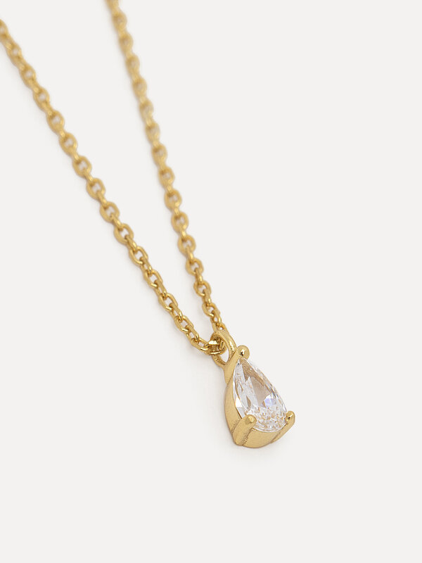 Les Soeurs Necklace Romee Extra Fine Chain Pear 1. The delicate pendant with a pear-shaped zirconia gemstone set in prong...