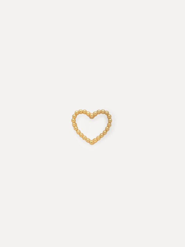 Les Soeurs Earring Jolie Dotted Heart 4. This tiny heart earring features a cut out inner design and accentuated with sub...