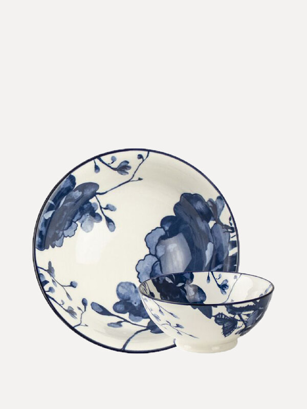 Gusta Bowl Peony. This white dish features a beautiful blue flower pattern and completes your set table. Made of earthenw...