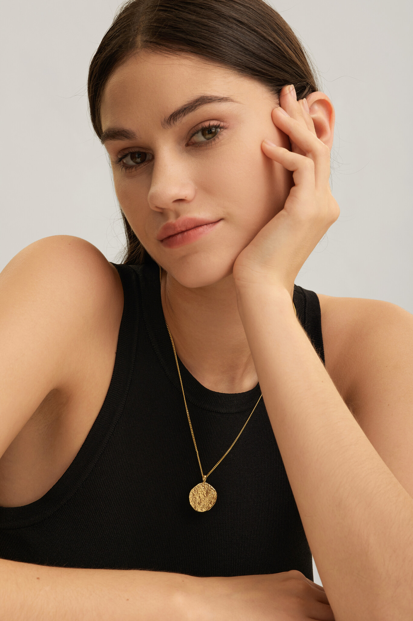 Les Soeurs Necklace Rana Amulet 2. Inspired by natural shapes, this organic coin necklace has a robust texture. Wear this...