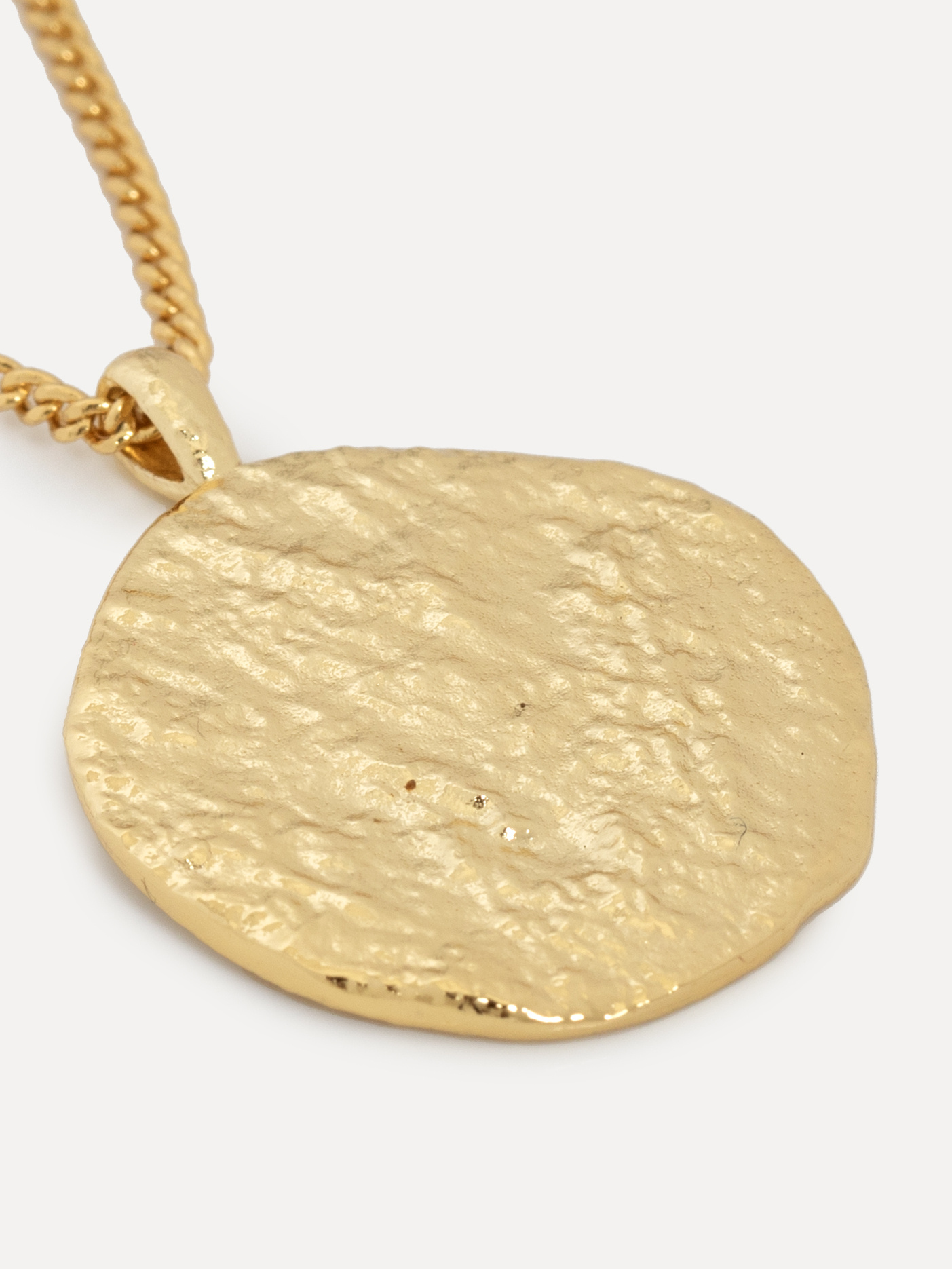 Les Soeurs Necklace Rana Amulet 4. Inspired by natural shapes, this organic coin necklace has a robust texture. Wear this...