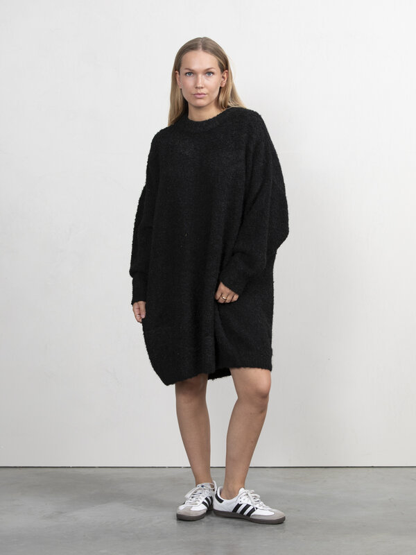 Les Soeurs Bouclé knitted dress Andres 3. This black knitted dress is a versatile choice for any occasion. The bouclé kni...