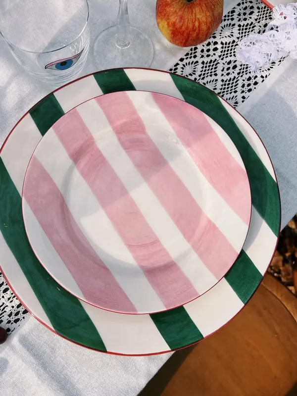 Anna + Nina Dinner Plate Lovebird 4. This ceramic dinner plate with green stripes and a hand-painted bird design is the p...