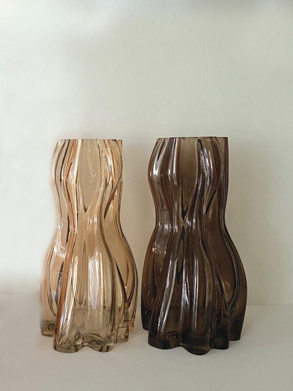 Opjet Vase Edgar 2. With its unique design and warm brown hue, this glass vase is an ideal addition to create an inviting...