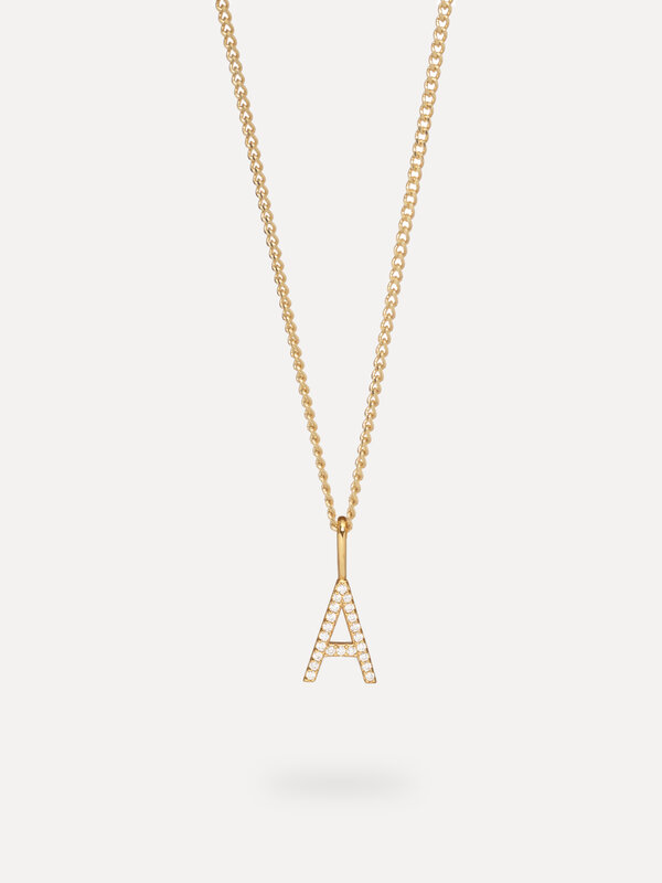 Les Soeurs Charm Initial Strass 2. Personalize your look with this charm, a subtly gilded letter form in 14-karat gold. N...