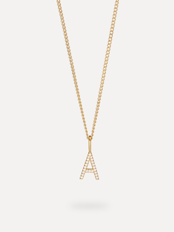 Les Soeurs Pendentif Initial Strass 2. Personnalisez votre look avec ce charm, une forme de lettre subtilement dorée en o...