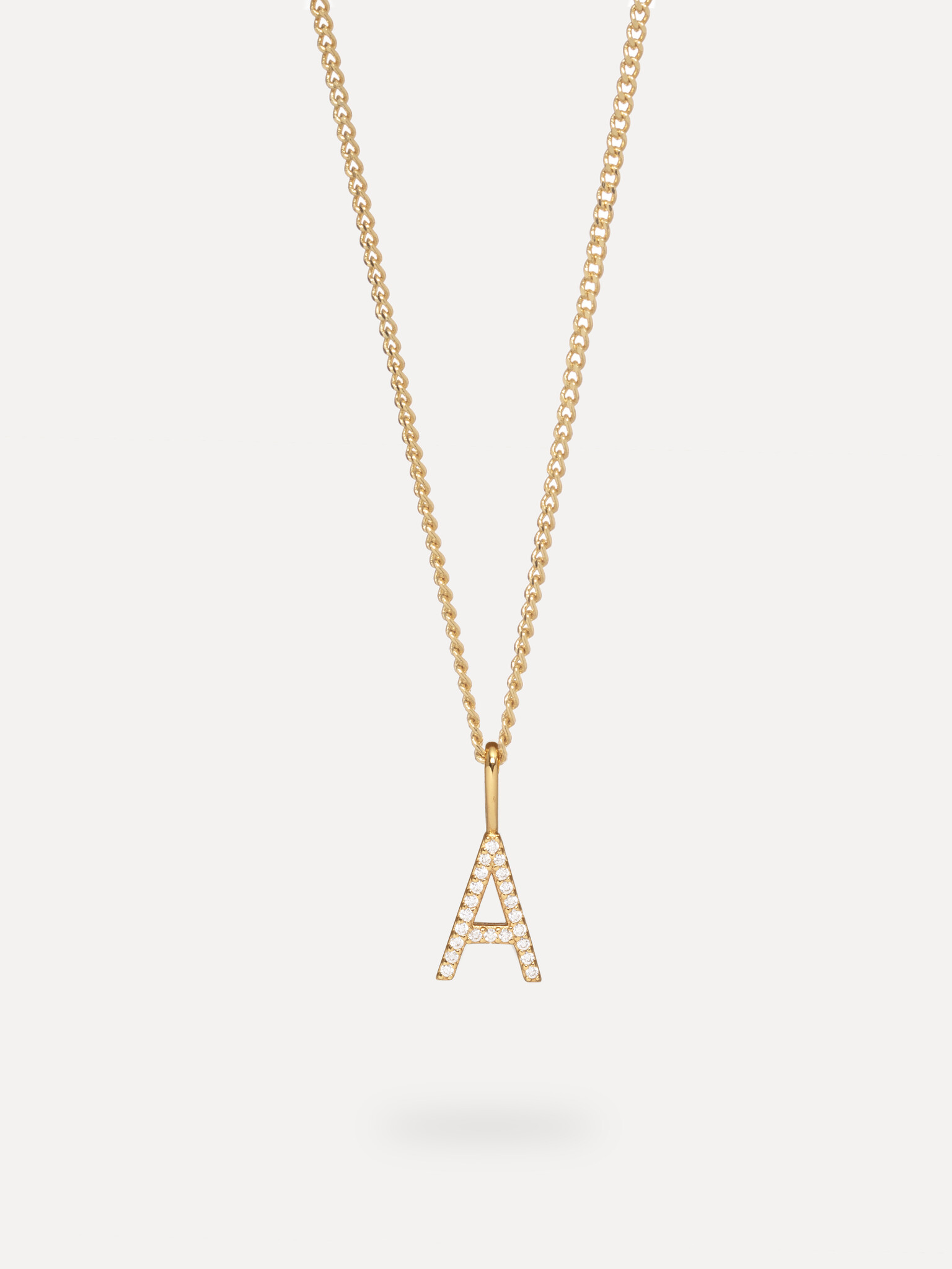 Les Soeurs Charm Initial Strass 3. Personalize your look with this charm, a subtly gilded letter form in 14-karat gold. N...