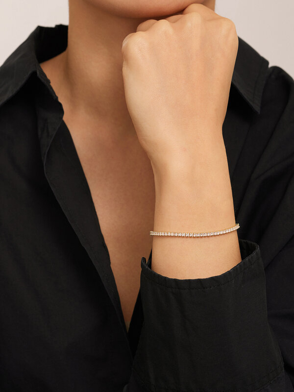 Les Soeurs Tennis Bracelet Bovi 3. Everyone loves a gold-dipped tennis bracelet. This dainty bracelet has a string of zir...