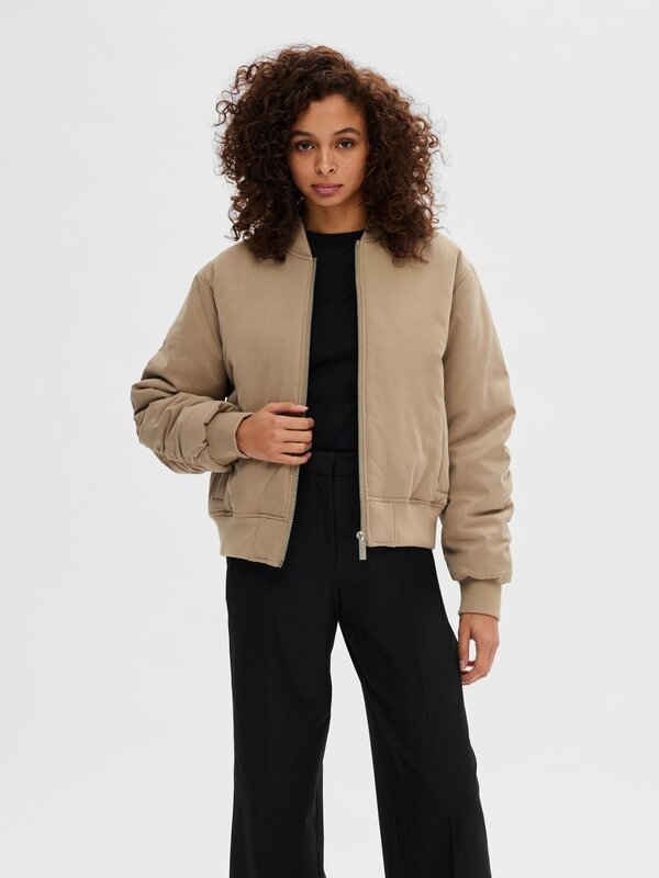 Selected Bomber jacket Netra 2. Discover the laid-back city vibes with this bomber. This jacket with ribbed collar, dropp...
