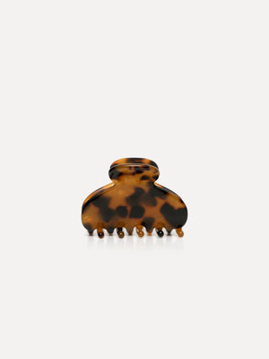 Hair clip round. Create a refined hairstyle with this small hair clip in dark tortoise, a subtle yet striking addition to...