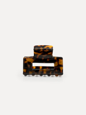 Hair Clip rectangle. This rectangular hairpin with a dark tortoise pattern offers a reliable grip, perfect for secure fix...