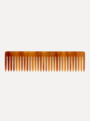 Hair comb. Upgrade your hair care routine with this comb, crafted from resin for a luxurious touch. This handy accessory ...