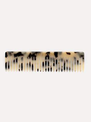 Hair comb. Upgrade your hair care routine with this comb, crafted from resin for a luxurious touch. This handy accessory ...