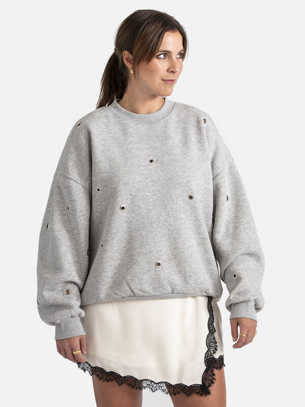 Edited Sweatshirt Ylva 1. Transform your everyday style with this comfortable gray sweatshirt where the metal round detai...