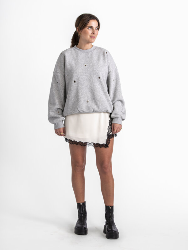 Edited Sweatshirt Ylva 3. Transform your everyday style with this comfortable gray sweatshirt where the metal round detai...
