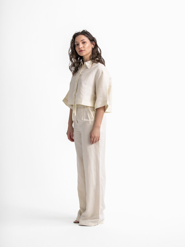 Edited Trousers Marthe 3. Embrace summer style with these linen paperbag trousers featuring wide legs, perfect for an air...