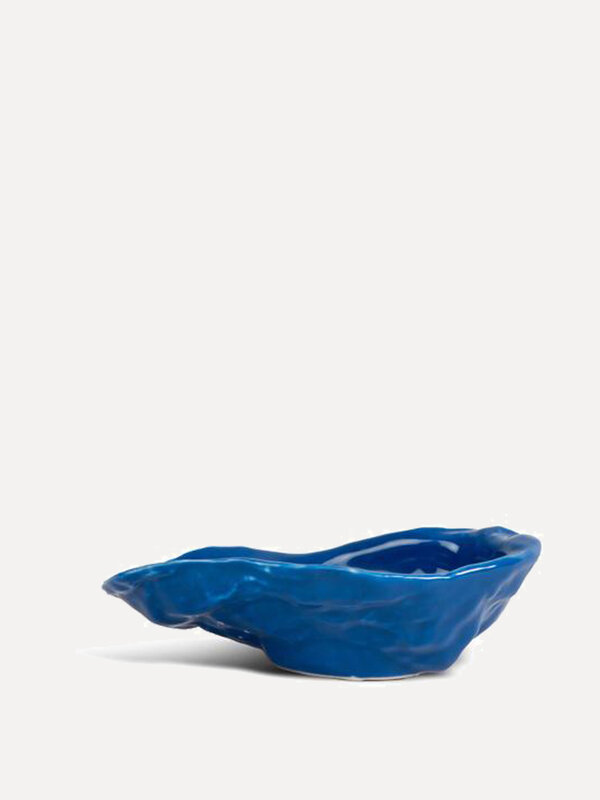 Oyster Bowl 1. Serve your favorite oysters in style with this blue oyster bowl, an elegant addition to any table setting.