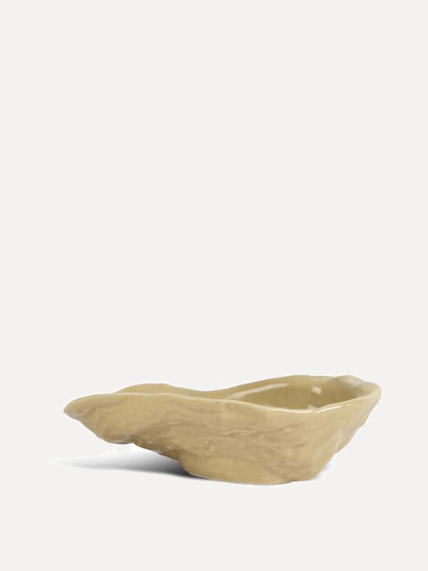 Oyster Bowl 1. Serve your favorite oysters in style with this beige oyster bowl, an elegant addition to any table setting.