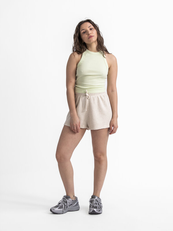 Edited Tanktop Orelia 3. Embrace the summer vibes with this ribbed tank top in a fresh pastel green color, instantly givi...