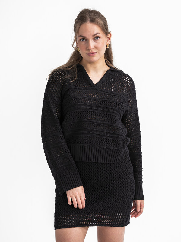 Selected Crochet pull Fina 1. This black crocheted sweater offers a relaxed fit for an effortlessly comfortable feel. The...