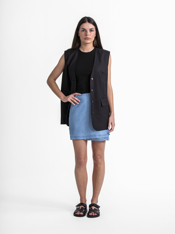 Edited Wrap skirt Xani 3. Opt for a contemporary and unique look with this blue short wrap skirt. The skirt combines asym...