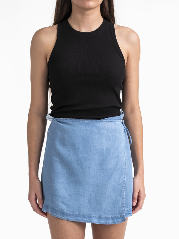 Edited Wrap skirt Xani 4. Opt for a contemporary and unique look with this blue short wrap skirt. The skirt combines asym...