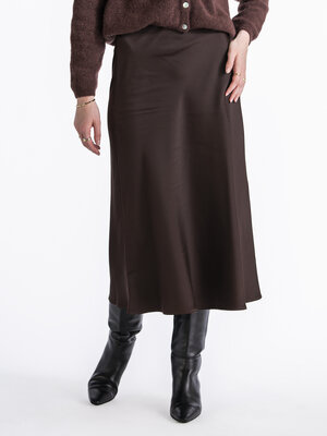 Jupe mi-longue Lena. Chaque garde-robe a besoin d'une jupe midi versatile et flatteuse, comme cette jupe en satin doux. S...