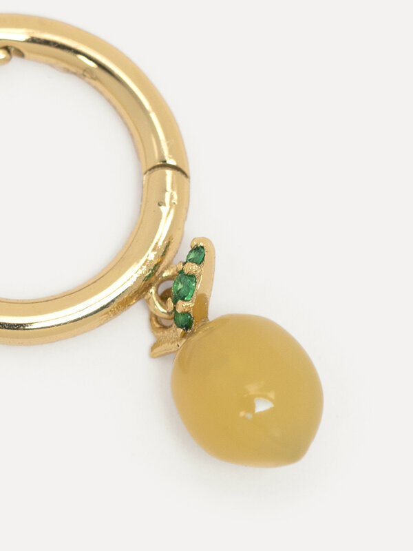 Les Soeurs Earring Joanne Lemon 2. When life gives you lemons, wear them. The gold ring gives this piece of jewelry a cla...