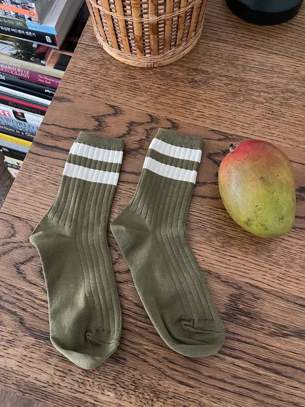 Le Bon Shoppe Socks Her Varsity 4. Feet up with this colorful pair of socks! The contrasting white stripes and ribbed tex...