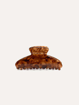 Hair clip claw. No more bad hair days! This tortoise hair clip in a warm brown shade is the perfect blend of style and co...