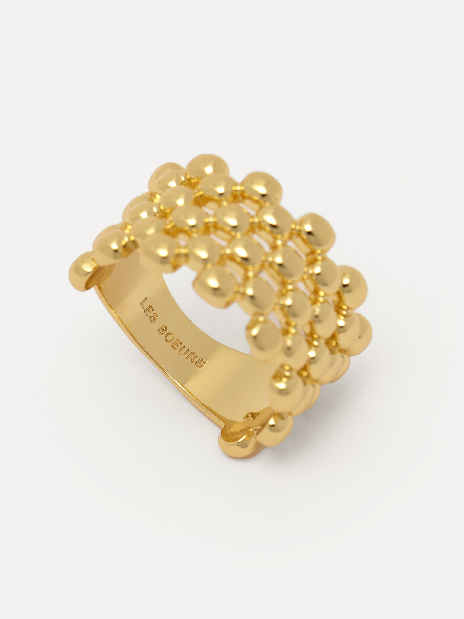 Les Soeurs Bague Claire Mesh 2. Parfaitement aligné! Cette bague accrocheuse, composée de quatre rangées de boules brilla...