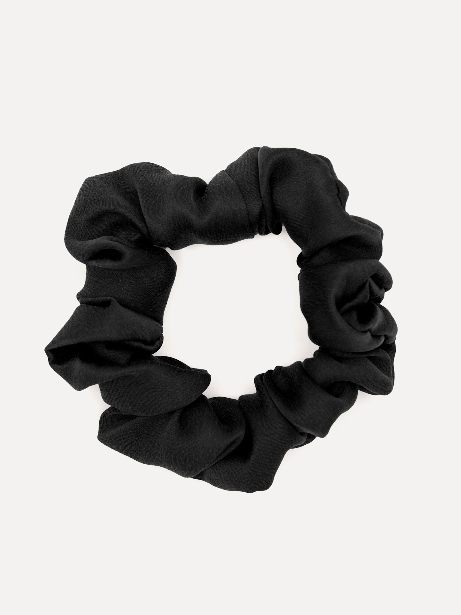 Les Soeurs Silk scrunchie 1. Luxury for your locks! This large black scrunchie keeps your hair smooth and frizz-free, eve...