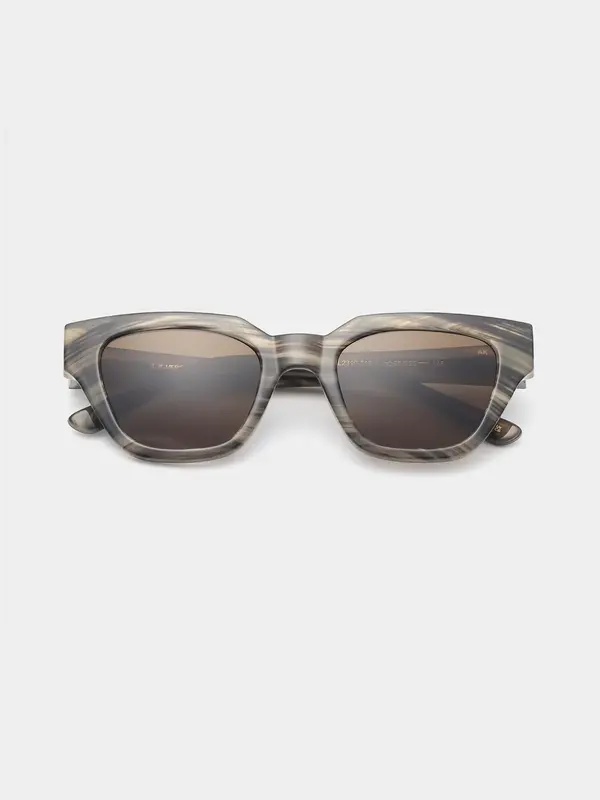 A.Kjaerbede Sunglasses Kaws 1. Coffee date or beach stroll? With these sunglasses, you can do both. The marbled frame loo...