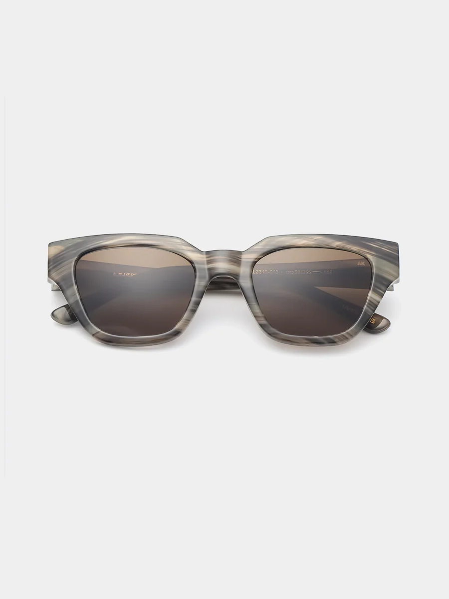 A.Kjaerbede Sunglasses Kaws 1. Coffee date or beach stroll? With these sunglasses, you can do both. The marbled frame loo...