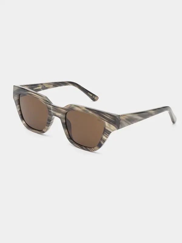 A.Kjaerbede Sunglasses Kaws 5. Coffee date or beach stroll? With these sunglasses, you can do both. The marbled frame loo...
