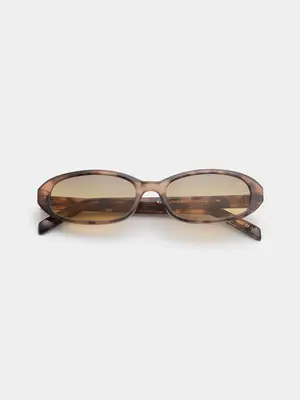 Lunettes de soleil Macy. Tinted & tortoise! Ces lunettes de soleil ovales avec filtre bronzé sont faites pour les jours o...