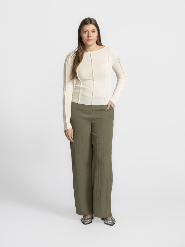 Edited Longsleeve top Halima 1. Cream dream! Looking for a top that subtly stands out? This one has it all: decorative ve...