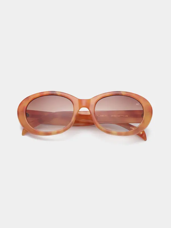 A.Kjaerbede Sunglasses Anma 4. Oval is in! With its amber-toned frame and smoked lenses, this ANMA pair adds just the rig...