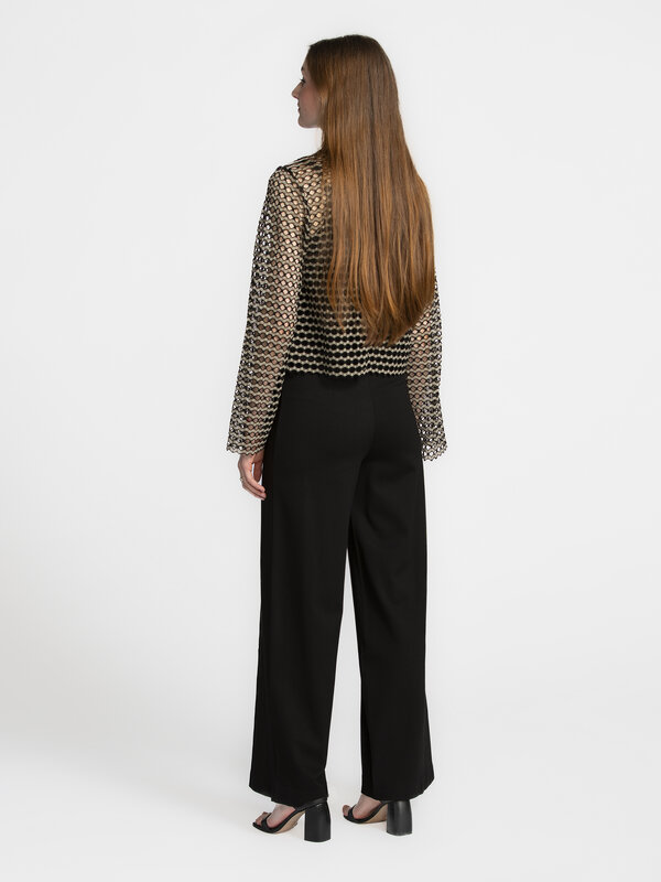 Edited Wide trousers Leva 5. Black never gets boring with these dressy pants. Wide legs that make a statement, paired wit...