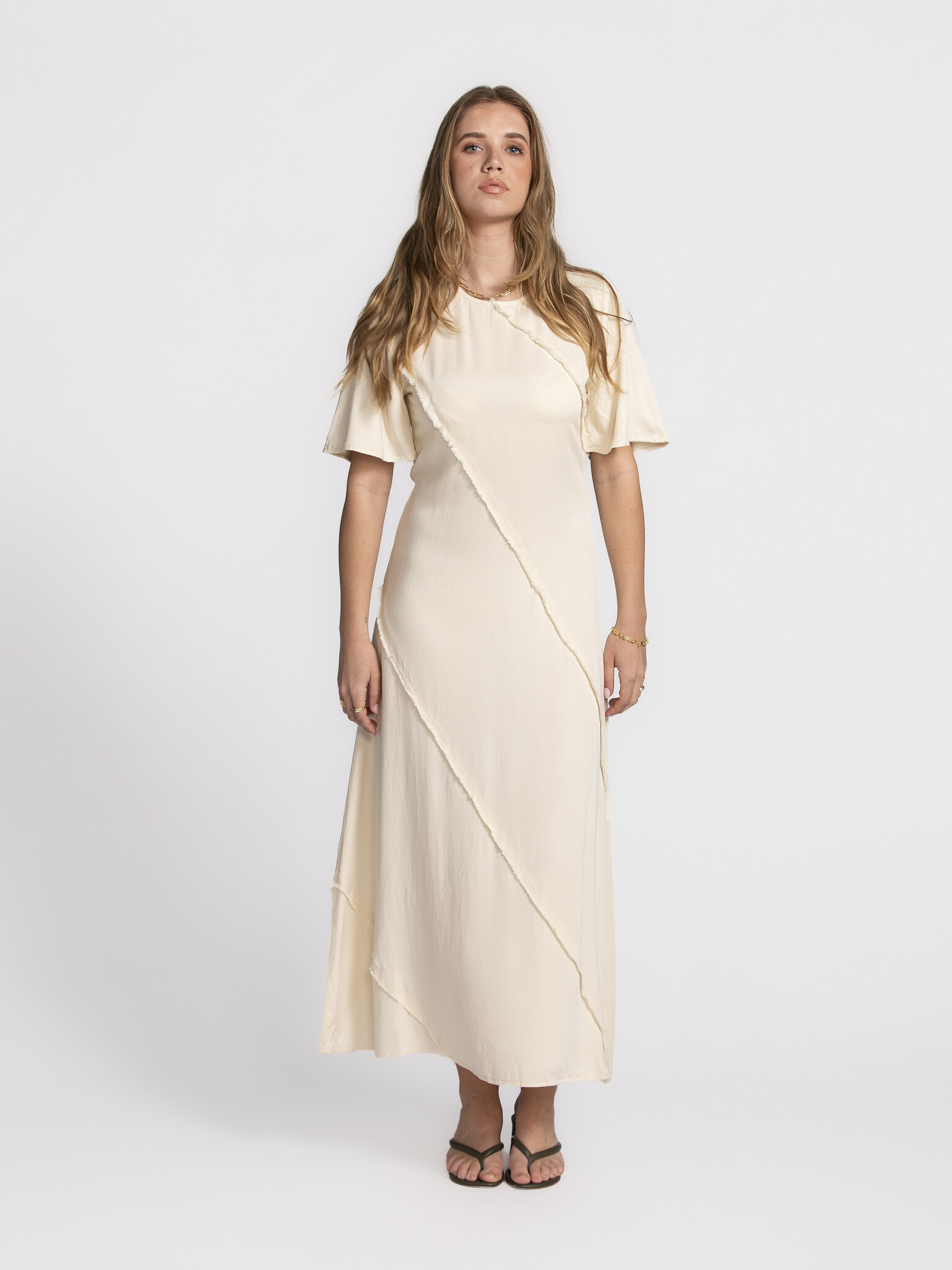 Selected Ankle Dress Ivana 1. Dream in cream! This long cream-colored ankle dress with raw edges is what dreams are made ...