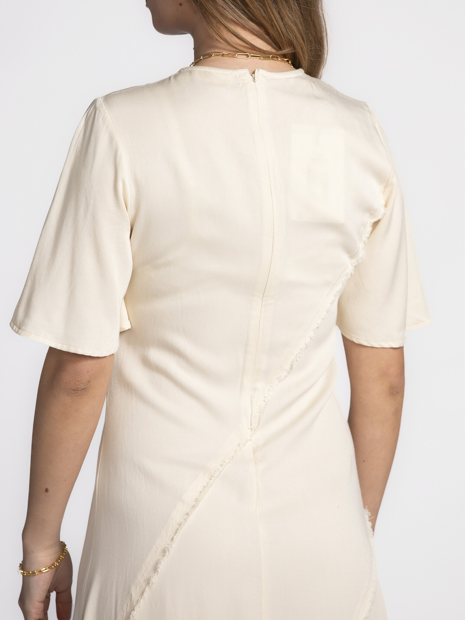 Selected Ankle Dress Ivana 5. Dream in cream! This long cream-colored ankle dress with raw edges is what dreams are made ...