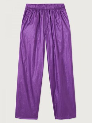 Jogging Wavybow. Sportive avec style. Ce pantalon de jogging brillant violet ne passe pas inaperçu. Portez-le avec des ba...