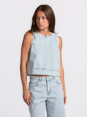 Top Raina. Denim done differently - This sleeveless light blue denim top is a summer must-have. The straight cut and stur...