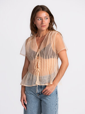 Blouse Cenia. This will make you blush! With its sheer fabric, delicate pink hue and playful bow details, this blouse bri...